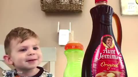 Dad performs magic for son.
