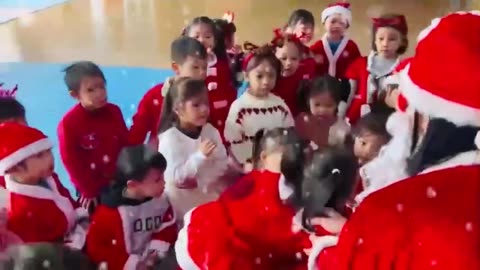 Merry Christmas : Children receive gifts from Santa Claus