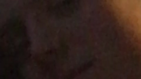 Guy green shirt sitting down on sofa