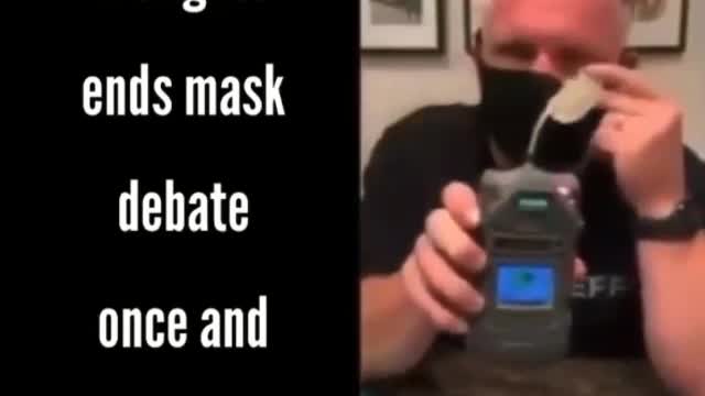 Firefighter demonstrates oxygen-deprevation using face masks