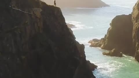 America strolls over one of the most spectacular sea arches on the Oregon coast.