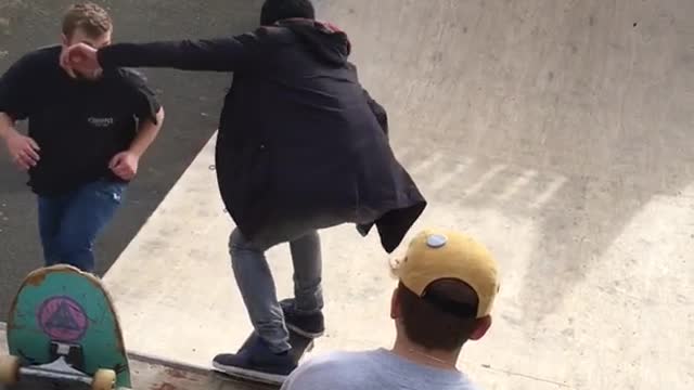 Black jacket kid glasses drops in halfpipe skateboard falls