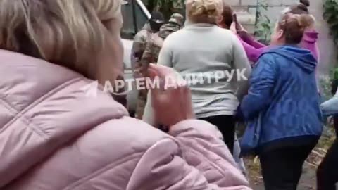Women in Kharkov successfully fight to protect the last man in their building