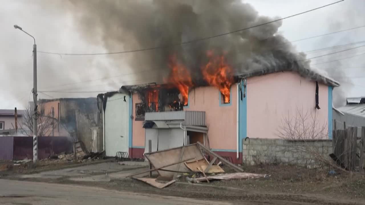 Houses burn after Russian bombing outside of Kyiv