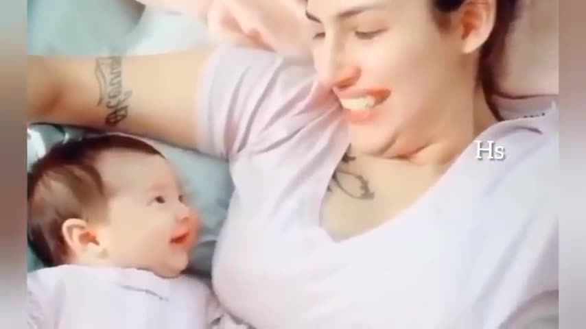 baby looking at her mom