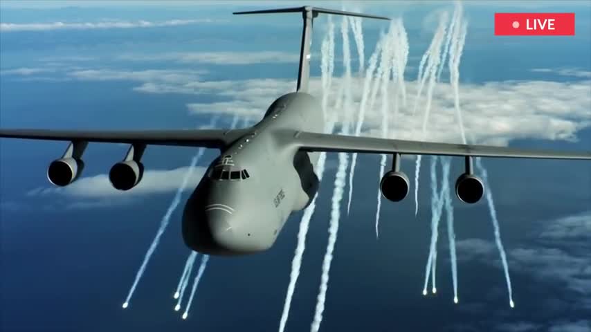 US Cargo Plane Transports weapons for Ukraine, accompanied by F-35 fighter jets.