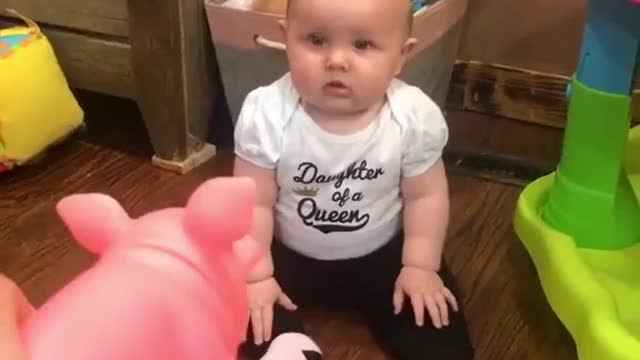 The baby's expression is cute, surprised and then crying