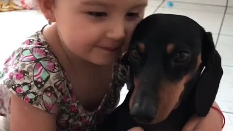 Little Girl Loves Her Puppy