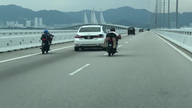 Malaysian Motorists Perform Group Stunt over Penang Bridge