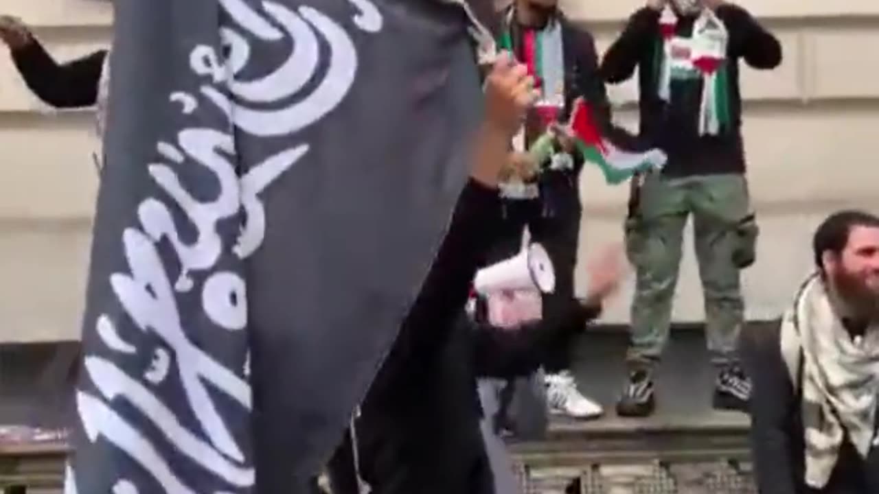 What flag is this "gentleman" waving in London?