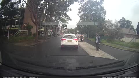 Man Narrowly Dodges Van Crossing the Street