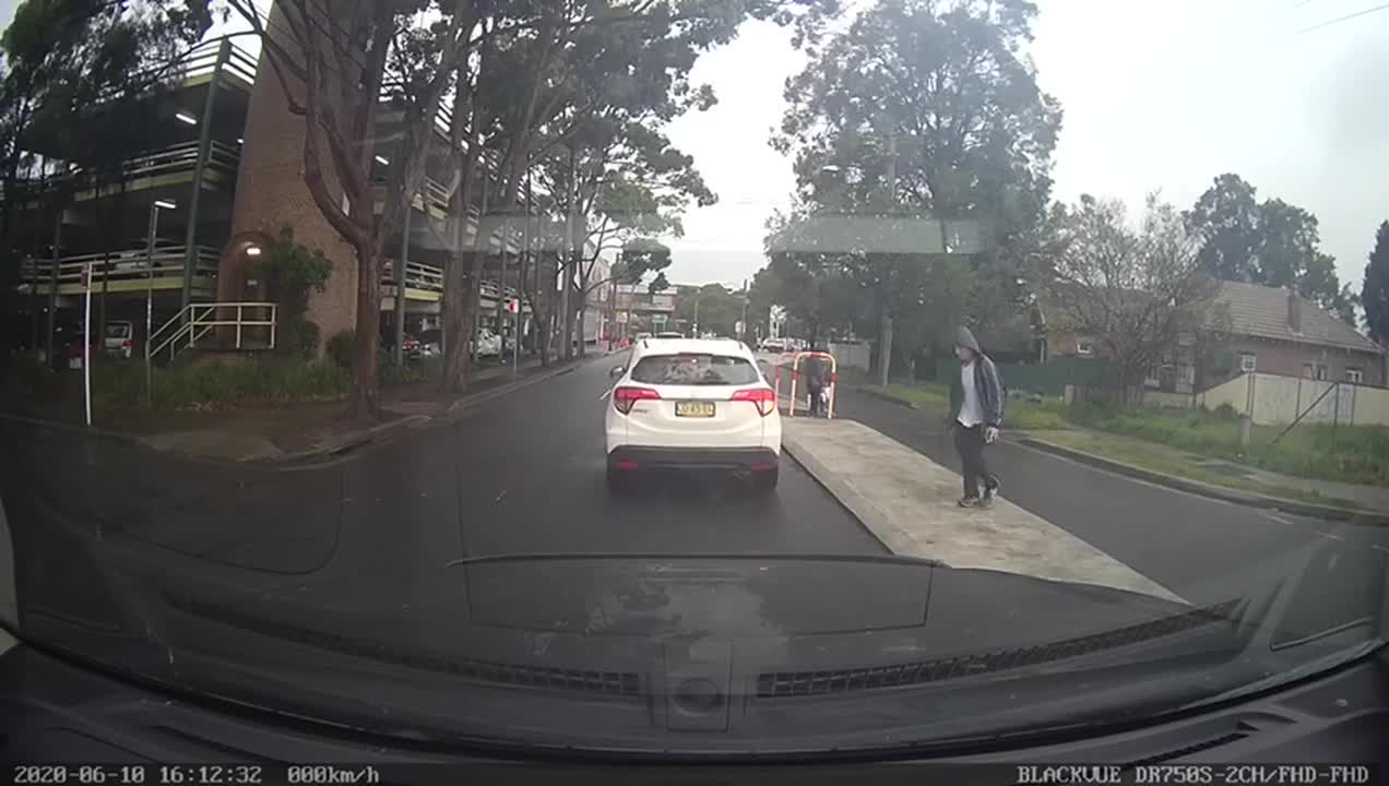 Man Narrowly Dodges Van Crossing the Street