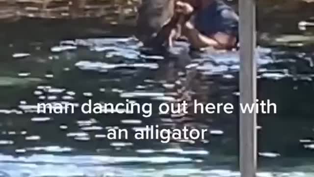 Man dance with crocodile