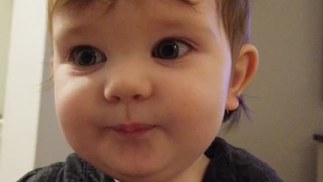 Baby hiccups repeatedly while laughing.