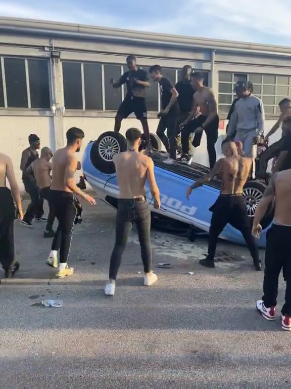 Italian police car destroyed by North African immigrants. It's probably a music