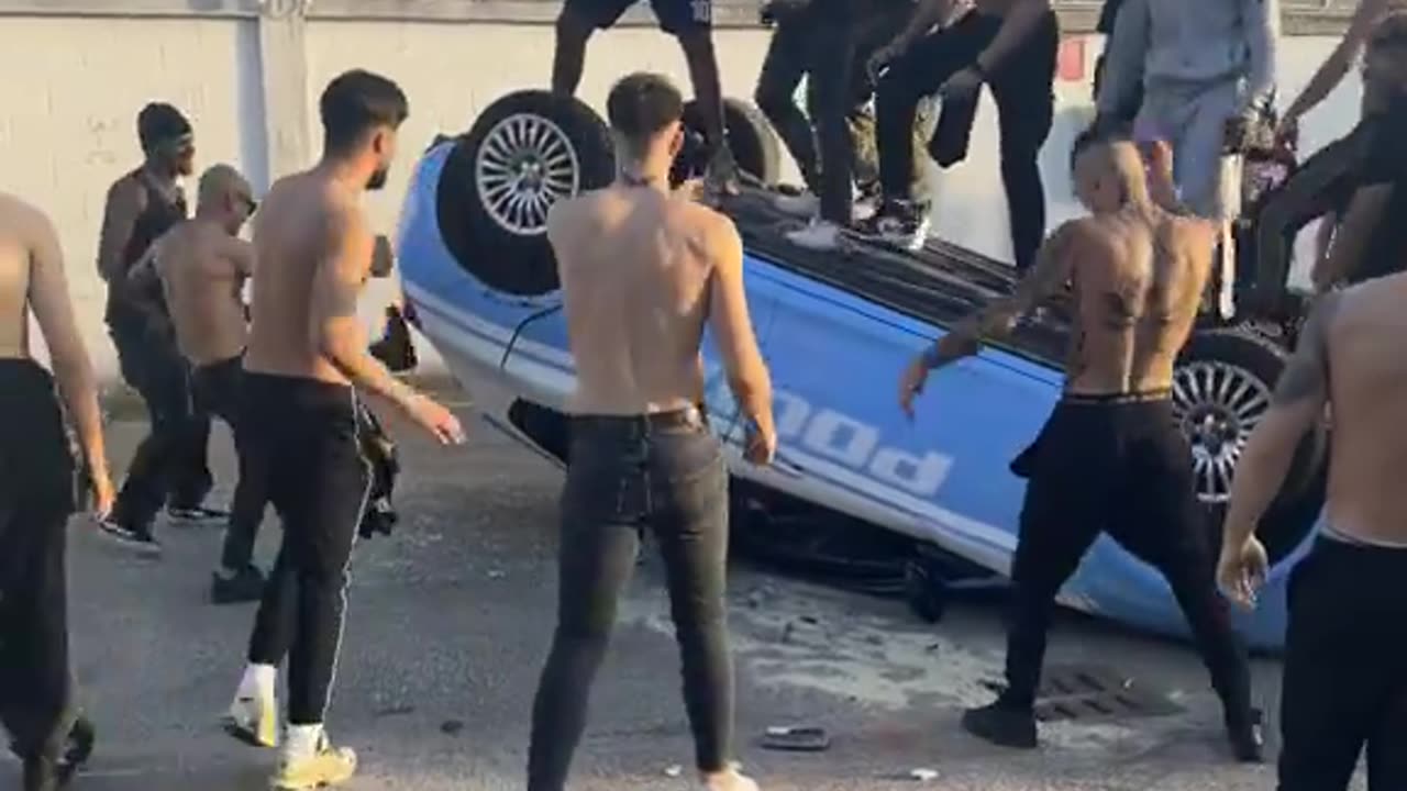 Italian police car destroyed by North African immigrants. It's probably a music