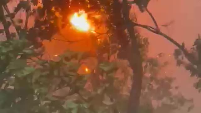 amazing scenario in India. Fire and rain together