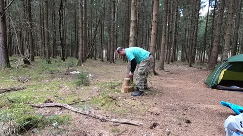 Making a seat to sit on in the woods