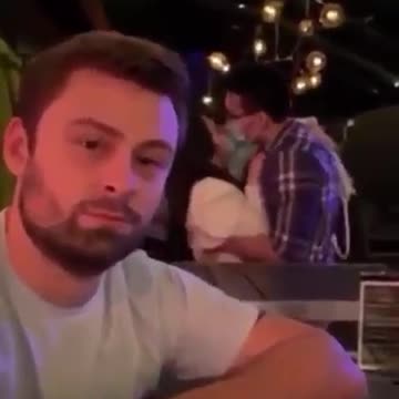 Couple kisses with masks on..Am done call me when corona ends