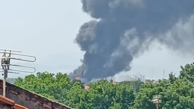 Smoke rises from one of the burning offices