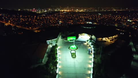 Night View from Drone on Holiday Resort and Big City