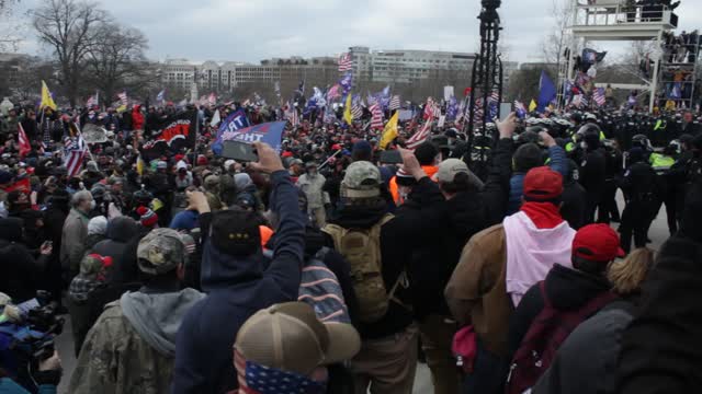 People gather at the 5 story monkey bar area capitol building jan 6