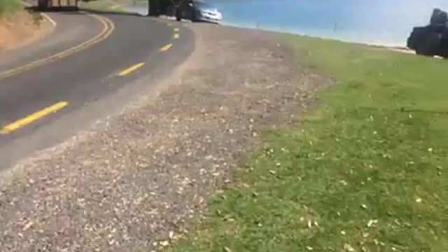 VEHICLE TOWING BIKE INTO RAMP 70KMPH+ CLEARING 15METRES INTO WATER