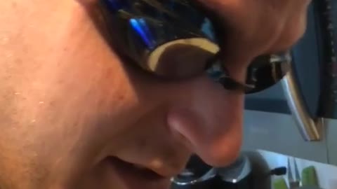 Man cuts onions with swim goggles