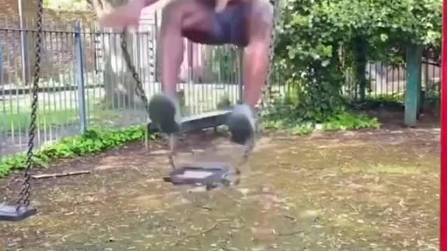 Man falling down from a swing!!