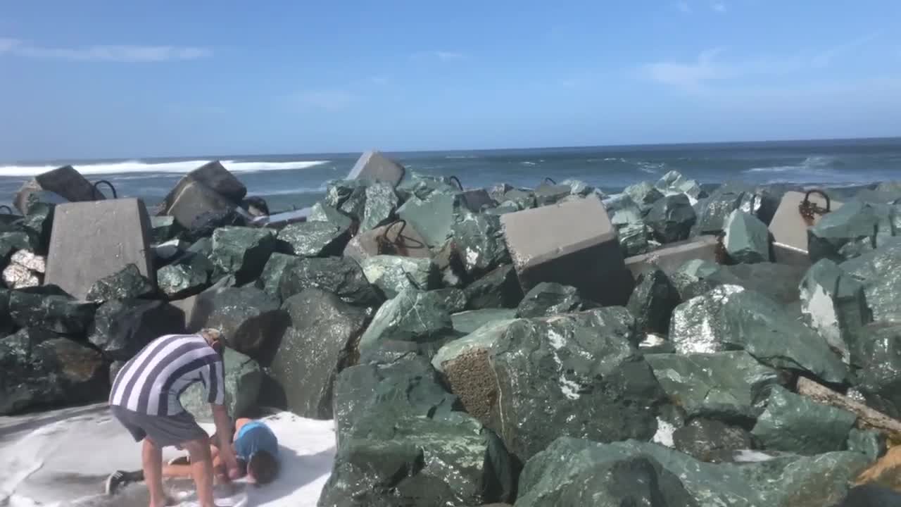 Kid Gets Swept off His Feet by Ocean