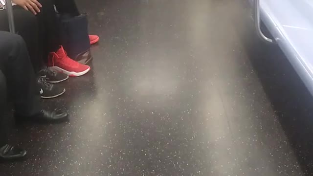 Sleeping homeless person subway green