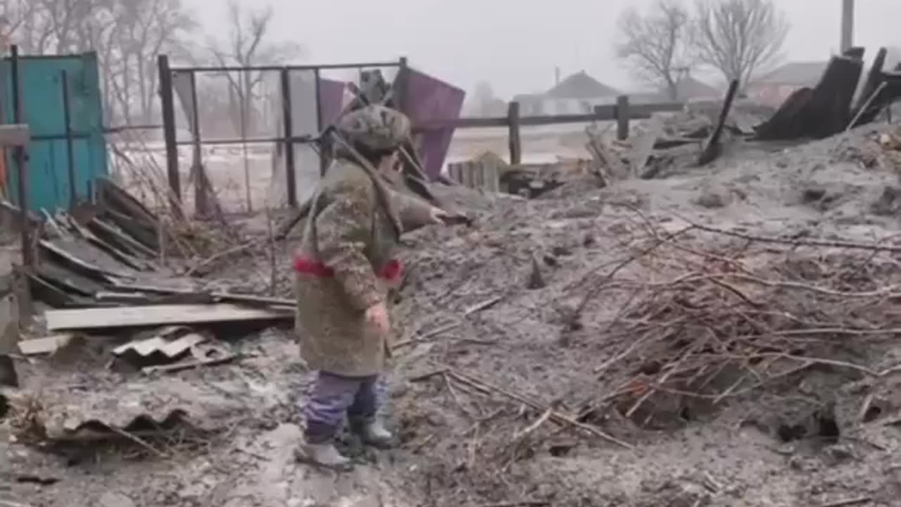 Ukraine - landscapes of the apocalypse. A grandmother and a funnel near the house.