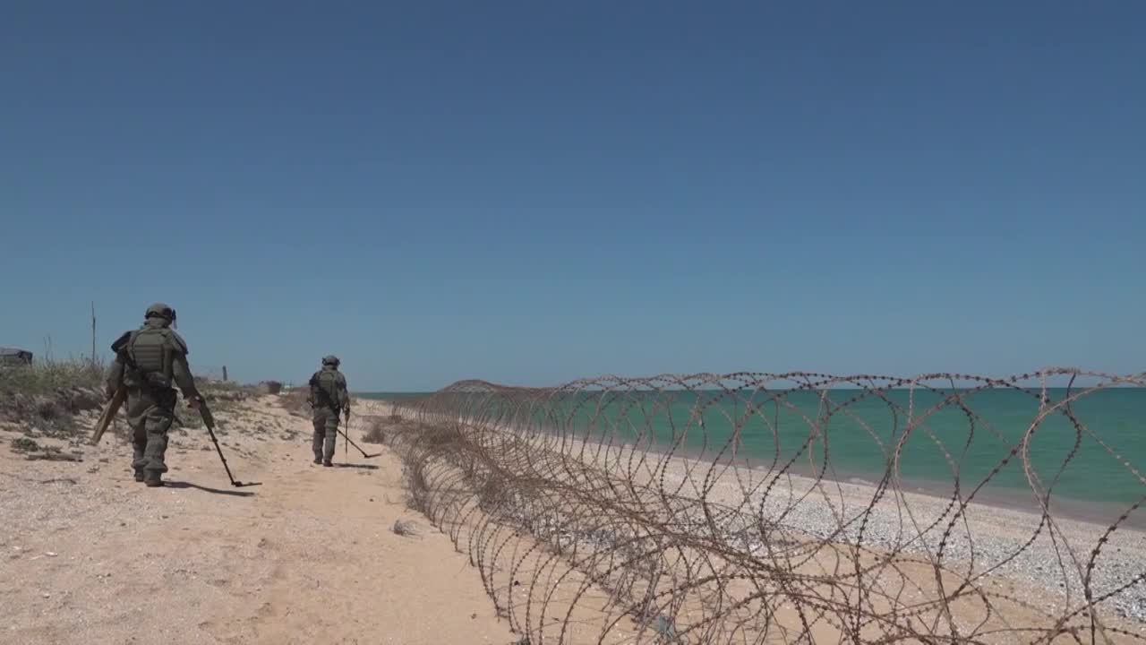 Footage of mine-clearance at Arabatskaya Strelka