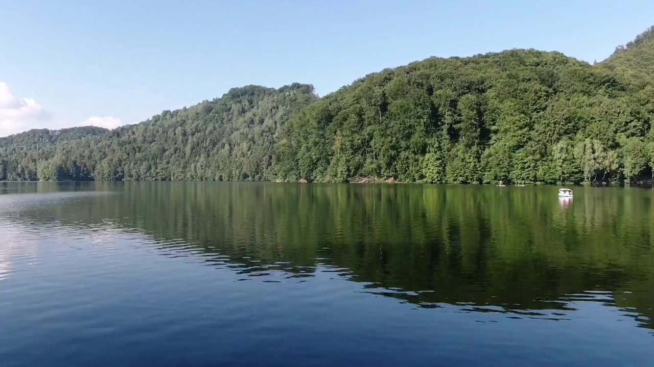 Smooth drone flight over the lake