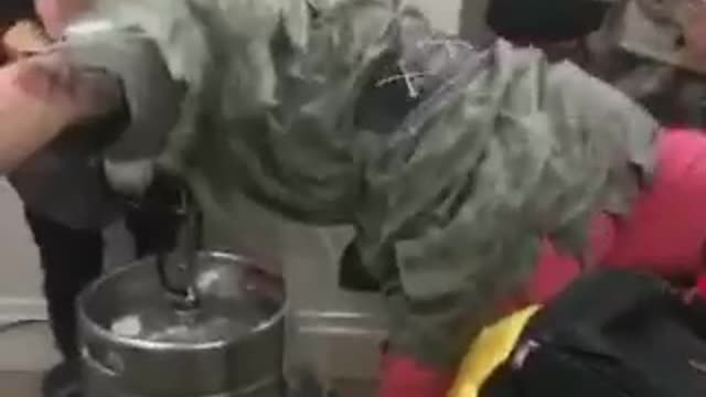 Guy in green faceplants on while doing keg stand