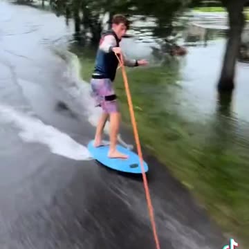 Boys having fun get pulled over after Wake Surfing through the streets in Florida