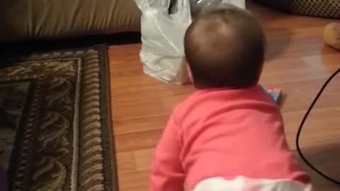 Baby sister tries to wake her big brother