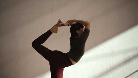 Woman in Natarajasana lord of the dance pose