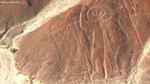 Who or what is this guy waving at on the Nazca Plateau? (Nazca Astronaut)