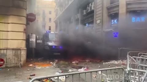 Spain:#2 Demonstrators turned into Protesters in Barcelona as they set the police HQ On fire.