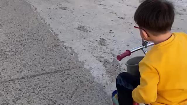 My nephew riding a bicycle in the countryside of Korea.