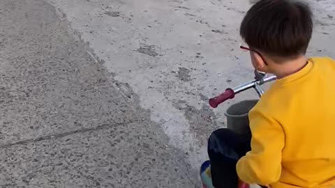 My nephew riding a bicycle in the countryside of Korea.