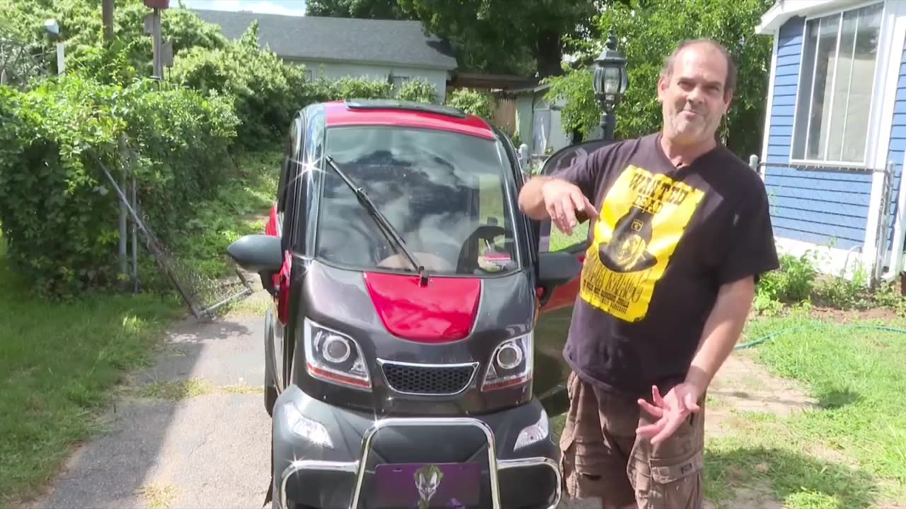 Man has a mobility scooter that looks like a car