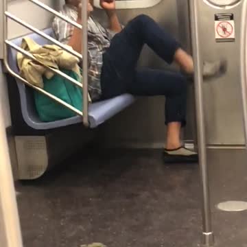 Man kicks air at the end of subway train