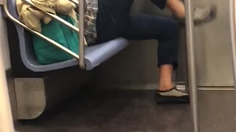 Man kicks air at the end of subway train