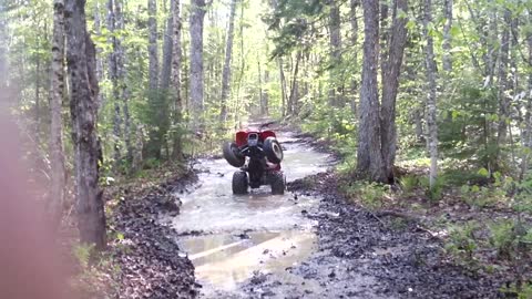 Red quad stuck river revs falls back