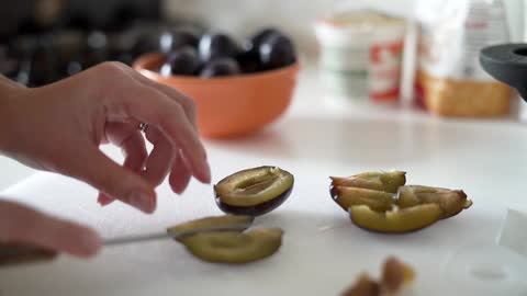 Cutting a plum