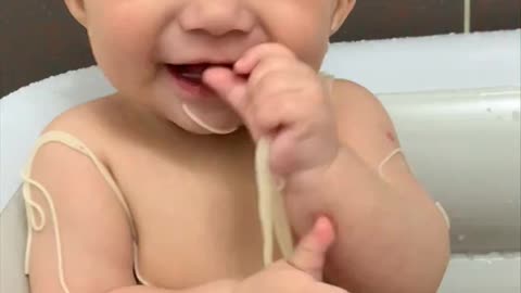 A baby who plays with the touch.