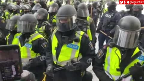 Canadians sing national anthem amidst face off with police