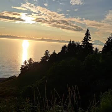 Iliamna Mountain and Redoubt Mountain on 7/29/23 at sunset. Alaska